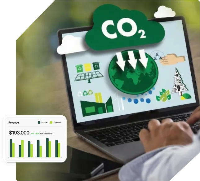 Person using a laptop displaying a carbon accounting dashboard with CO2 cloud icon, emissions data, and a floating revenue chart.